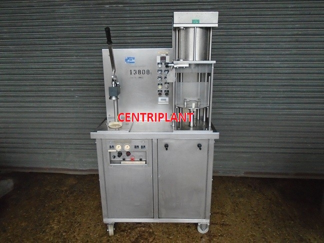 13808 - A I D PACKAGING SEMI AUTOMATIC COUNTER PRESSURE FILLER AND CROWNER