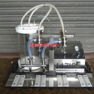 14713 - TENCO TWIN HEAD ENOLMASTER VACUUM FILLER - SOLD AS IS - REQUIRES NEW SEALS AND REPAIR