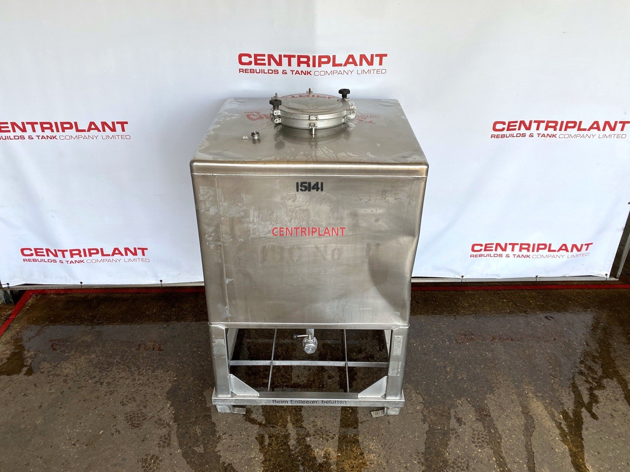 15141 - 1,000 LITRE STAINLESS STEEL TRANSPORT TANK. DENT ON SIDE